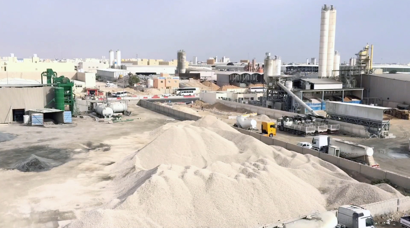 Street 41 in the Doha Industrial Area, workshops and trucks on both sides